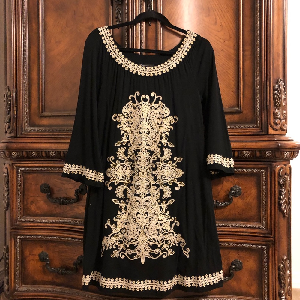 Embroidered knee length dress.